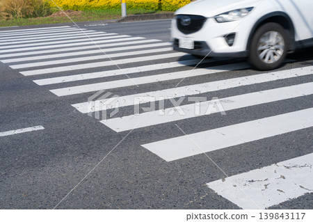 Cars driving on a pedestrian crossing Cars driving on a pedestrian crossing 139843117