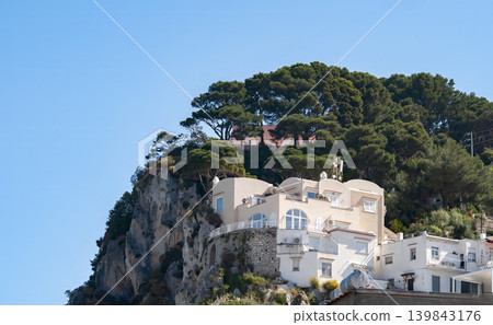 Coastal slopes of the island Capri with luxurious villas located on them. 139843176