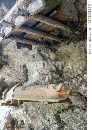 Carved cave tomb with a buffalo head in a Toraja sanctuary, Sulawesi, Indonesia Carved cave tomb with a buffalo head in a Toraja sanctuary, Sulawesi, Indonesia 139843820