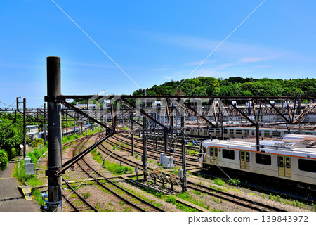 View of the Tokyu Corporation's Nagatsuta train depot from an overpass on the Tokyu Den-en-toshi Line. View of the Tokyu Corporation's Nagatsuta train depot from an overpass on the Tokyu Den-en-toshi Line. 139843972