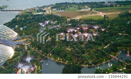 Singapore at dusk, with the giant greenhouse dome and Supertrees beautifully lit up. Singapore at dusk, with the giant greenhouse dome and Supertrees beautifully lit up. 139844291
