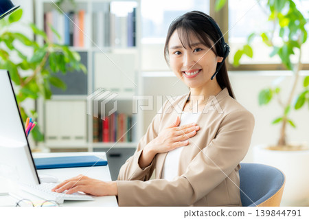 Female operator working in the office Female operator working in the office 139844791