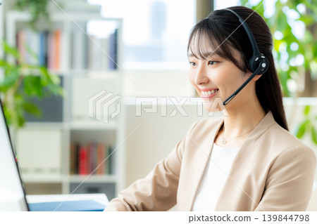 Female operator working in the office Female operator working in the office 139844798