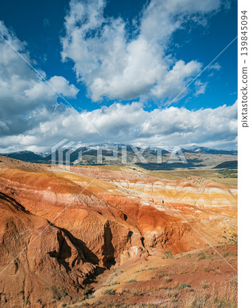 A panoramic view of the Altai region on Mars, featuring vibrant red and yellow stratified hills A panoramic view of the Altai region on Mars, featuring vibrant red and yellow stratified hills 139845094
