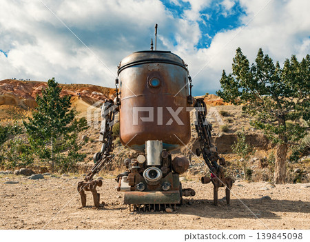 Detailed rusty robot stands in a unique Altai Mars landscape Detailed rusty robot stands in a unique Altai Mars landscape 139845098