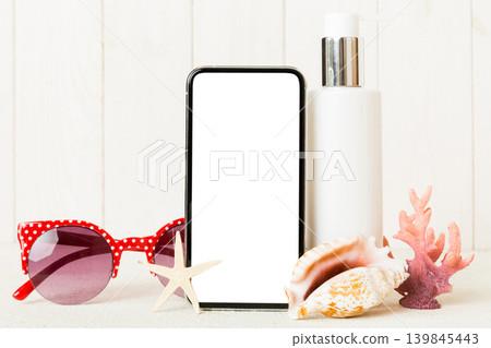Smartphone mock up template with summer objects. Perspective view with copy space for text Smartphone mock up template with summer objects. Perspective view with copy space for text 139845443