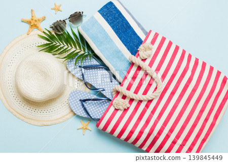 Composition with stylish beach accessories on colored background, top view. Beach fashion flat lay, summer concept. Trendy colors Composition with stylish beach accessories on colored background, top view. Beach fashion flat lay, summer concept. Trendy colors 139845449