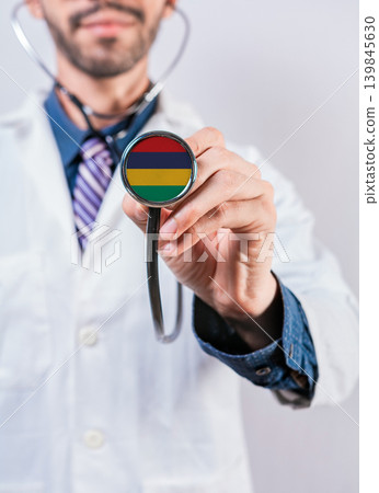 Mauritius health and medical insurance concept. Mauritius healthcare system, doctor holding stethoscope Mauritius health and medical insurance concept. Mauritius healthcare system, doctor holding stethoscope 139845630