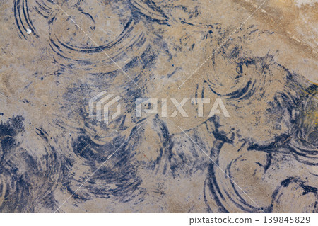 Abstract blue ink strokes on aged textured paper. Concept of analogue imperfection, tactile minimalism, and artistic expression. Unique hand-drawn pattern for creative branding and organic design. Abstract blue ink strokes on aged textured paper. Concept of analogue imperfection, tactile minimalism, and artistic expression. Unique hand-drawn pattern for creative branding and organic design. 139845829
