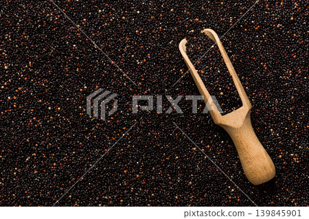 black quinoa grain in wooden spoon background and texture of gluten free top view black quinoa grain in wooden spoon background and texture of gluten free top view 139845901