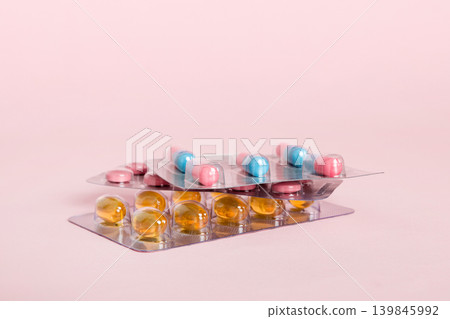 too many different pill cartridges stacked. selective Focus. Packs of blister pills with tablets. Colored pastilles packages. A pile of medicine in blister packs. Pharmaceutical blister packs too many different pill cartridges stacked. selective Focus. Packs of blister pills with tablets. Colored pastilles packages. A pile of medicine in blister packs. Pharmaceutical blister packs 139845992