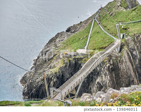Cliffside walkway over dramatic coastal rocks Cliffside walkway over dramatic coastal rocks 139846011