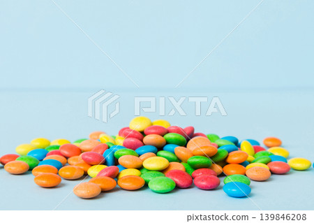Pile of delicious colorful sweet candies on colored background top view. Confectionery decor Pile of delicious colorful sweet candies on colored background top view. Confectionery decor 139846208
