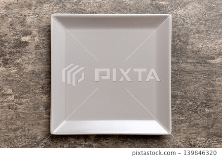 Top view of empty square plate on cement background. Empty space for your design 139846320
