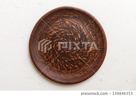 Top view of empty plate on cement background. Empty space for your design Top view of empty plate on cement background. Empty space for your design 139846353