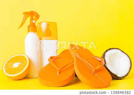 Top view composition of flip flops placed with beach accessories perspective view on table background. Tropical summer vacation concept Flat lay Top view composition of flip flops placed with beach accessories perspective view on table background. Tropical summer vacation concept Flat lay 139846382