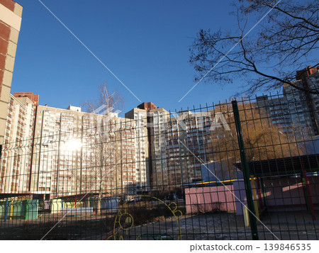 Apartment buildings with a fence in front 139846535