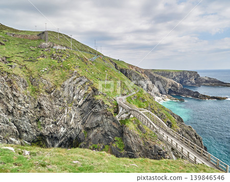 Coastal cliff path along rugged sea shoreline Coastal cliff path along rugged sea shoreline 139846546
