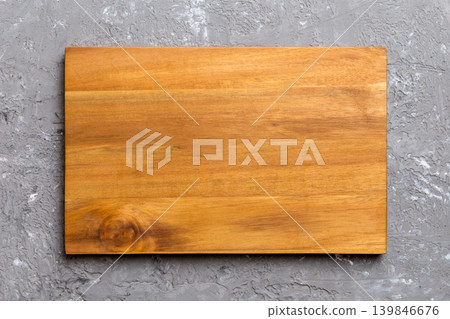 Top view of wooden cutting board on cement background. Empty space for your design 139846676