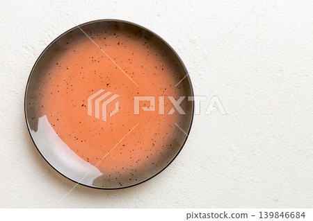 Top view of empty red plate on cement background. Empty space for your design Top view of empty red plate on cement background. Empty space for your design 139846684