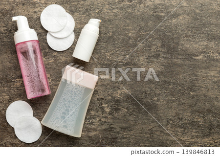 Micellar cleansing water and discs to remove cosmetics and cleanse the skin on colored background. Copy space top view 139846813