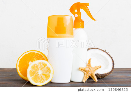 dispenser bottle and Citrus fruit in skincare product. beauty spa medical skincare and cosmetic lotion bottle cream product on table decor background with summer accessories dispenser bottle and Citrus fruit in skincare product. beauty spa medical skincare and cosmetic lotion bottle cream product on table decor background with summer accessories 139846823