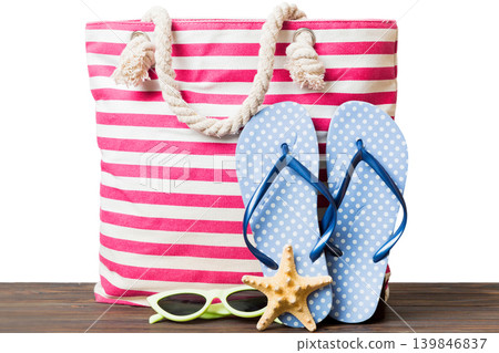 Stylish bag with beach accessories . Summer holiday concept. beach bag with straw hat with space for text 139846837