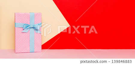 holiday handmade paper present tied blue ribbon bow top view with copy space. Flat lay holiday background. Birthday or christmas present. Christmas gift box concept with copy space 139846883