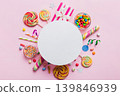 Flat lay holiday composition. Paper blank, lollipop, birthday decorations on Colored background. Top view, copy space for text 139846939