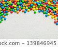 Mixed collection of colorful candy, on colored background. Flat lay, top view. frame of colorful chocolate coated candy 139846945