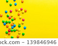 Mixed collection of colorful candy, on colored background. Flat lay, top view. frame of colorful chocolate coated candy 139846946