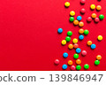 Mixed collection of colorful candy, on colored background. Flat lay, top view. frame of colorful chocolate coated candy 139846947