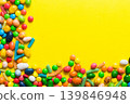 Mixed collection of colorful candy, on colored background. Flat lay, top view. frame of colorful chocolate coated candy 139846948