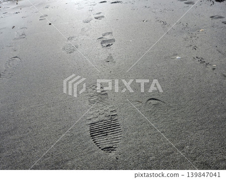 Human footprints on beach sand 139847041