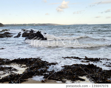 Empty Ocean Beach With Stormy Waves Background 139847078