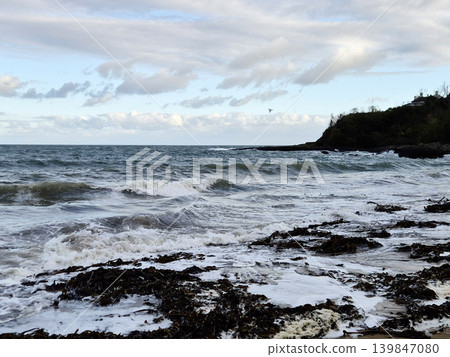 Empty Ocean Beach With Stormy Waves Background 139847080