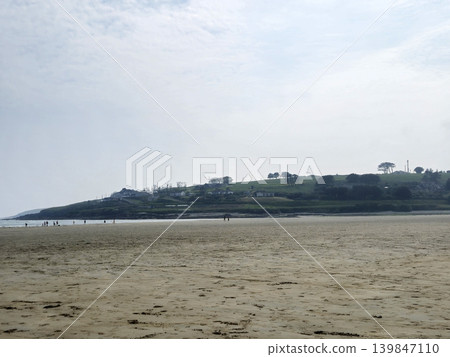 Deserted Beach And Hills Background 139847110