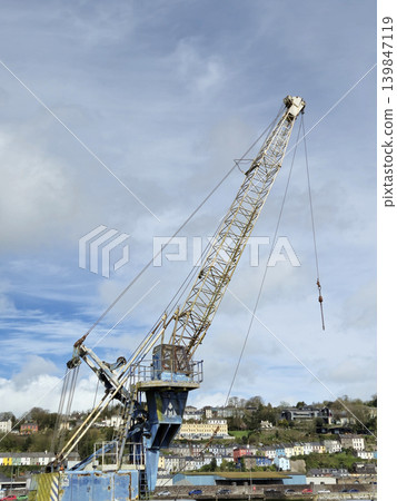 Construction Equipment and Watercraft Under Cloudy Sky with Crane and Drilling Rig Construction Equipment and Watercraft Under Cloudy Sky with Crane and Drilling Rig 139847119