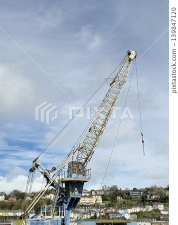Construction Equipment and Watercraft Under Cloudy Sky with Crane and Drilling Rig Construction Equipment and Watercraft Under Cloudy Sky with Crane and Drilling Rig 139847120