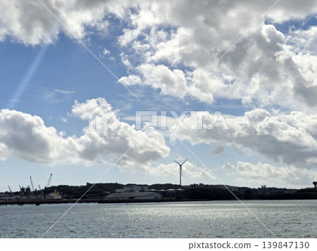 Wind Farm under Cloudy Sky with Water Reflection Wind Farm under Cloudy Sky with Water Reflection 139847130
