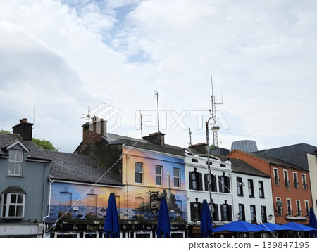 City Building Facade with Cloudy Sky and Roof View City Building Facade with Cloudy Sky and Roof View 139847195