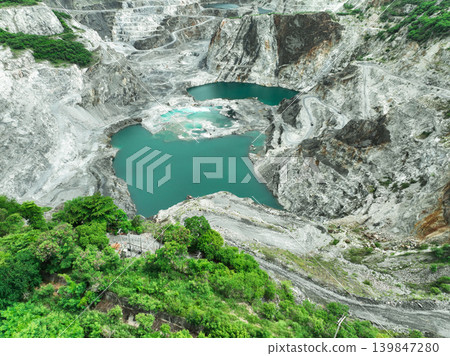 Open pit mine industry. Limestone quarry. Mining industry and construction material supply. Landscape of resource extraction in a industrial site Open pit mine industry. Limestone quarry. Mining industry and construction material supply. Landscape of resource extraction in a industrial site 139847280