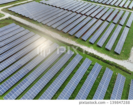 Solar farm and sun light. Solar power for green energy. Sustainable renewable energy. Photovoltaic power station or solar park. Solar panel installation and maintenance concept. Energy sustainability. 139847288