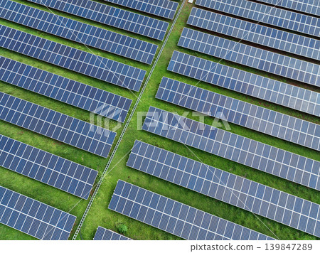 Aerial view solar farm. Solar power for green energy. Sustainable renewable energy. Photovoltaic power station. Solar panel installation. Energy sustainability. Eco-friendly electricity production. Aerial view solar farm. Solar power for green energy. Sustainable renewable energy. Photovoltaic power station. Solar panel installation. Energy sustainability. Eco-friendly electricity production. 139847289