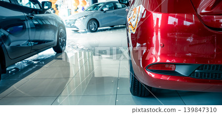 Car parked in luxury showroom. Car dealership office. Car showroom business. New car parked in modern showroom. Auto for sale and rent business. Automobile leasing and insurance. Electric automobile. 139847310