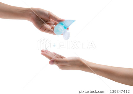 Woman hand holding hand sanitizer and drop on customer palm to kill coronavirus. Cleaning hands with alcohol gel to protect from germs, virus, and bacteria. Personal hygiene to prevent coronavirus. Woman hand holding hand sanitizer and drop on customer palm to kill coronavirus. Cleaning hands with alcohol gel to protect from germs, virus, and bacteria. Personal hygiene to prevent coronavirus. 139847412