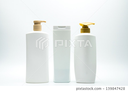 Set of shampoo and hair conditioner plastic bottles with pump for branding mockup in beauty and personal care product marketing concept. Packaging design branding and commercial haircare product. 139847428