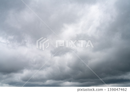 Dramatic overcast sky with gray and white clouds before rainy season storm, moody and gloomy weather background. Climate, meteorology, and atmospheric. Weather forecasting, climate change background. Dramatic overcast sky with gray and white clouds before rainy season storm, moody and gloomy weather background. Climate, meteorology, and atmospheric. Weather forecasting, climate change background. 139847462