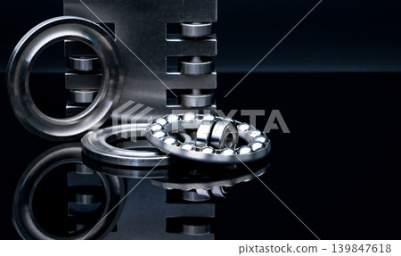 Stainless steel thrust ball bearing and linear bearing. Set of thrust ball bearing and shiny silver ball bearing. Spare parts for roller machine in heavy machinery. Round metal wheel of ball slides. Stainless steel thrust ball bearing and linear bearing. Set of thrust ball bearing and shiny silver ball bearing. Spare parts for roller machine in heavy machinery. Round metal wheel of ball slides. 139847618