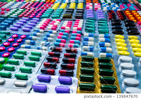 Colorful of tablets and capsules pill in blister packaging arranged with beautiful pattern. Pharmaceutical industry concept. Pharmacy drugstore. Defective and error in pharmaceutical factory concept. Colorful of tablets and capsules pill in blister packaging arranged with beautiful pattern. Pharmaceutical industry concept. Pharmacy drugstore. Defective and error in pharmaceutical factory concept. 139847670